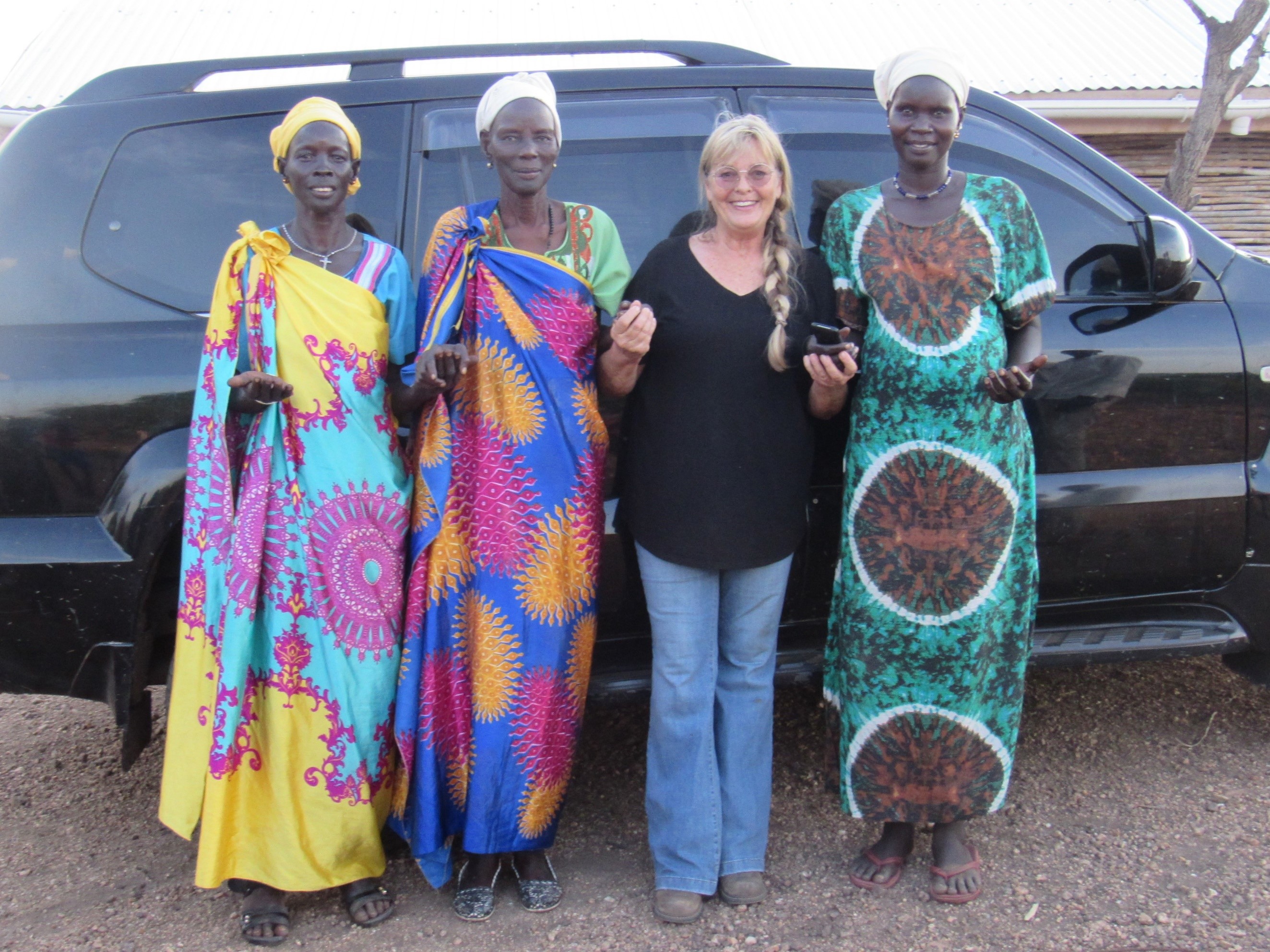 Denise with women in a refugee camp